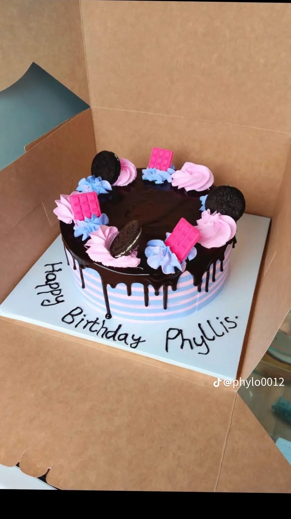 Phyllis's chocolate drip birthday cake with pink and blue decorations